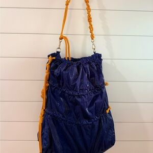 Elegant Navy Drawstring Backpack with Orange Accents